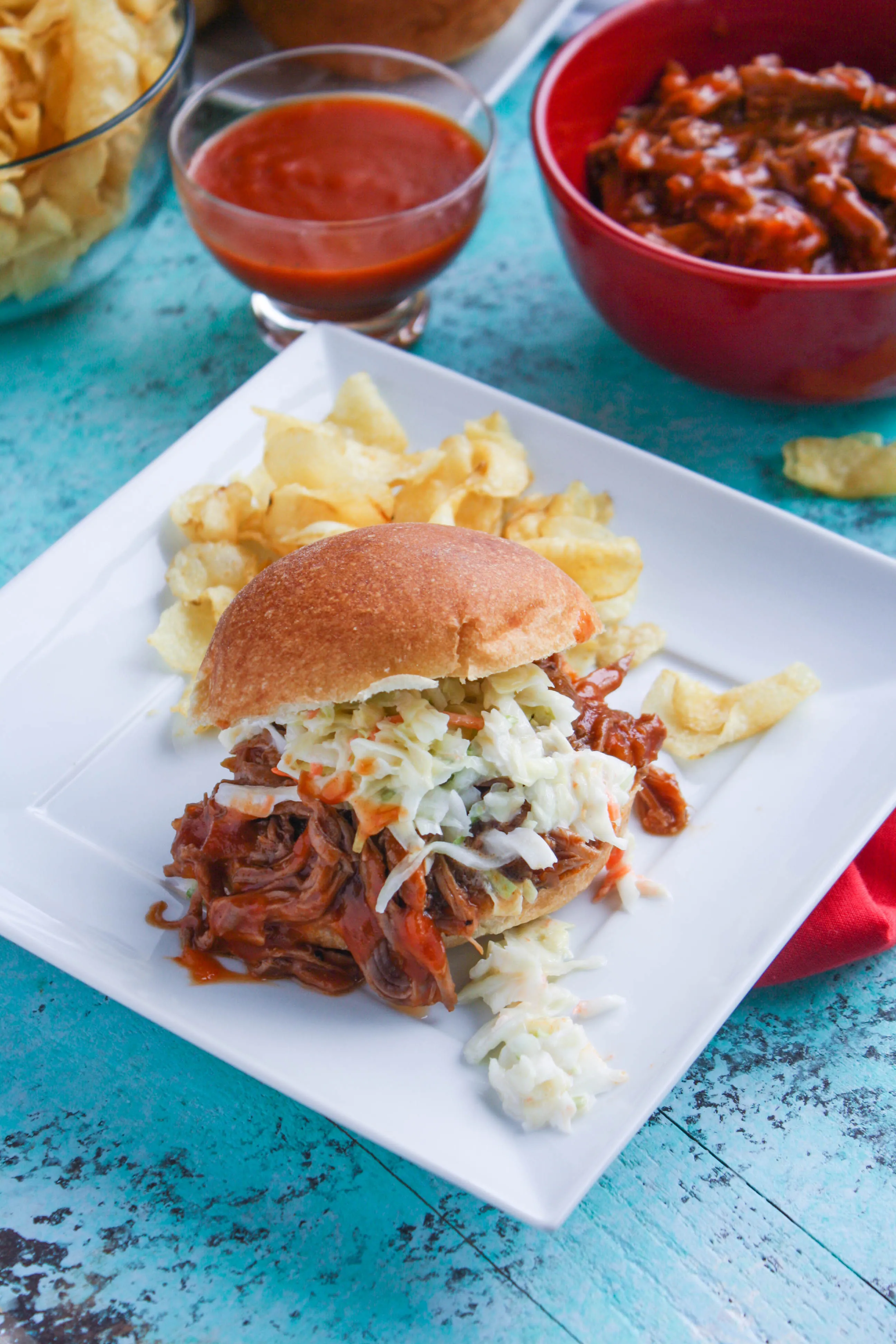 Slow Cooker BBQ Beef Sandwiches are great to serve to a group gathered for any occasion. Everyone will love these sandwiches, and the slow cooker makes them so easy to make!