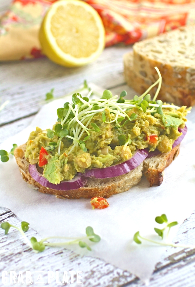 Delight in these filling and flavorful Spiced and Smashed Chickpea and Avocado Sandwiches #MeatlessMonday #vegan