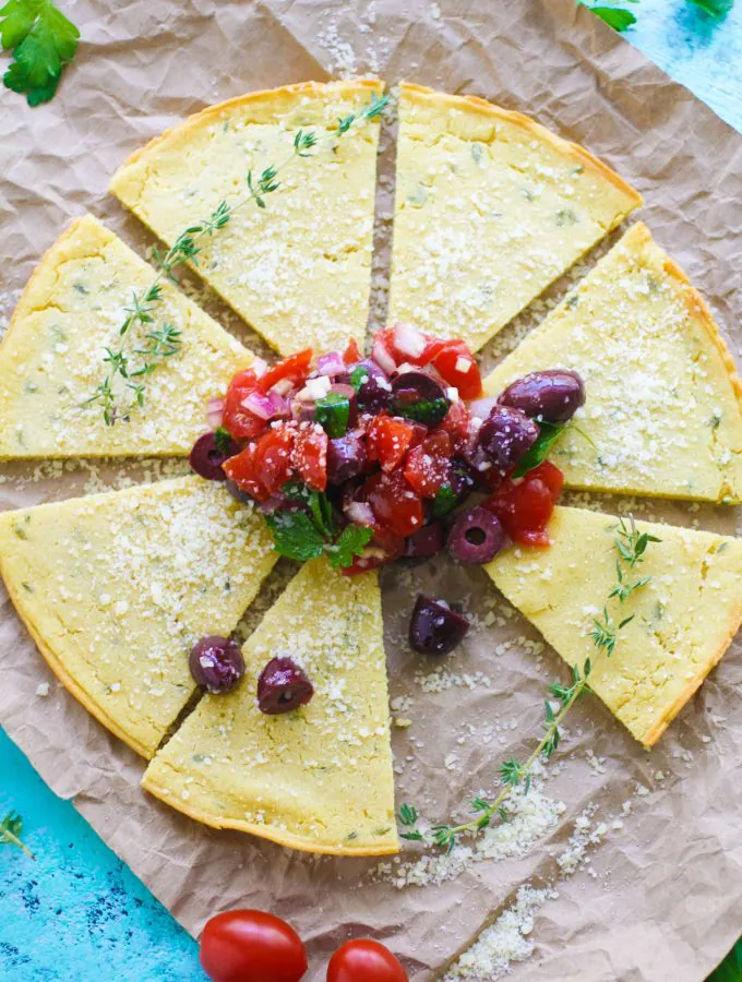Socca (Chickpea Flour) Flatbread with Tomato and Olive Salad make a wonderful snack between meals. Socca (Chickpea Flour) Flatbread with Tomato and Olive Salad is perfect for a snack, or as an appetizer -- you decide!