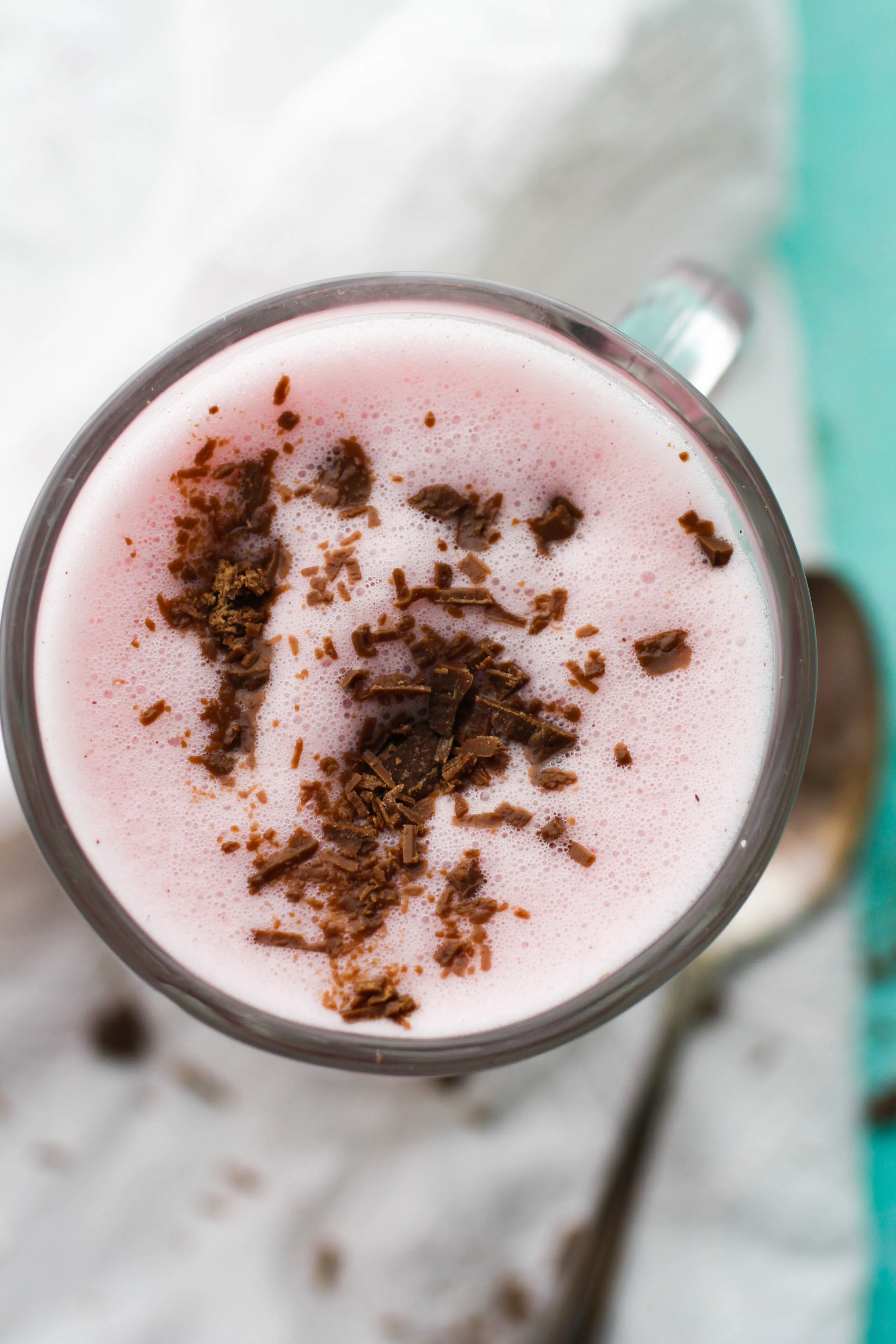 Spiced Beet and Oat Milk Latte is topped of with shaved chocolate. What a great beverage!