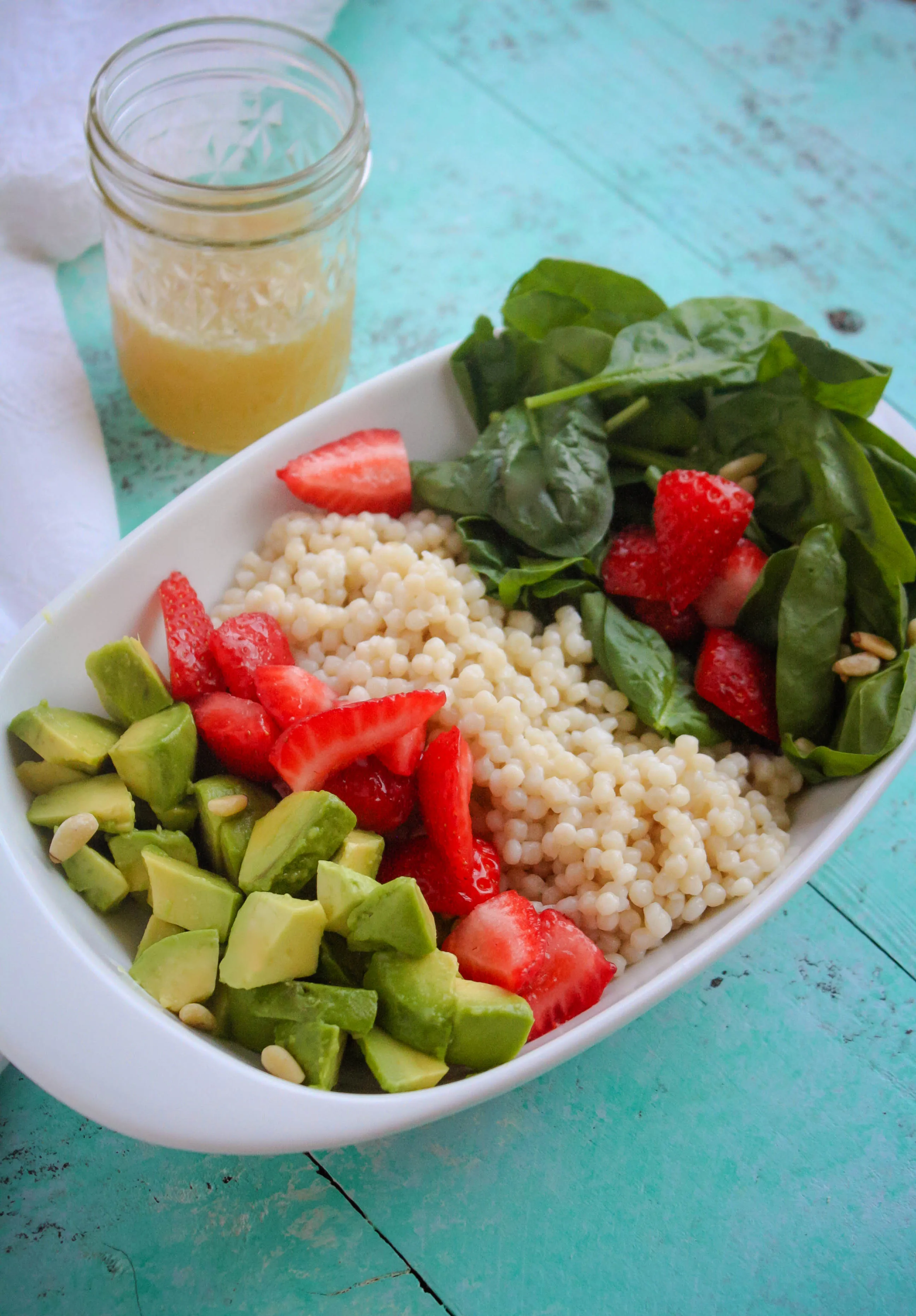 Spinach and Couscous Salad with Strawberries, Avocado & Honey-Lime Dressing is the kind of summer salad that will satisfy! Spinach and Couscous Salad with Strawberries, Avocado & Honey-Lime Dressing is a delightful summer dish.