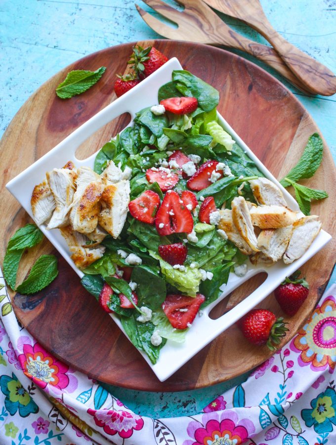 Chicken Salad with Strawberries and Honey-Lemon Mint Dressing is a fabulous salad to try this season. You'll love the homemade dressing, sweet strawberries, and how easy it is to make!