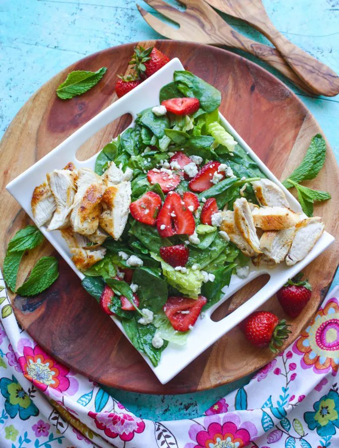Chicken Salad with Strawberries and Honey-Lemon Mint Dressing is a fabulous salad to try this season. You'll love the homemade dressing, sweet strawberries, and how easy it is to make!