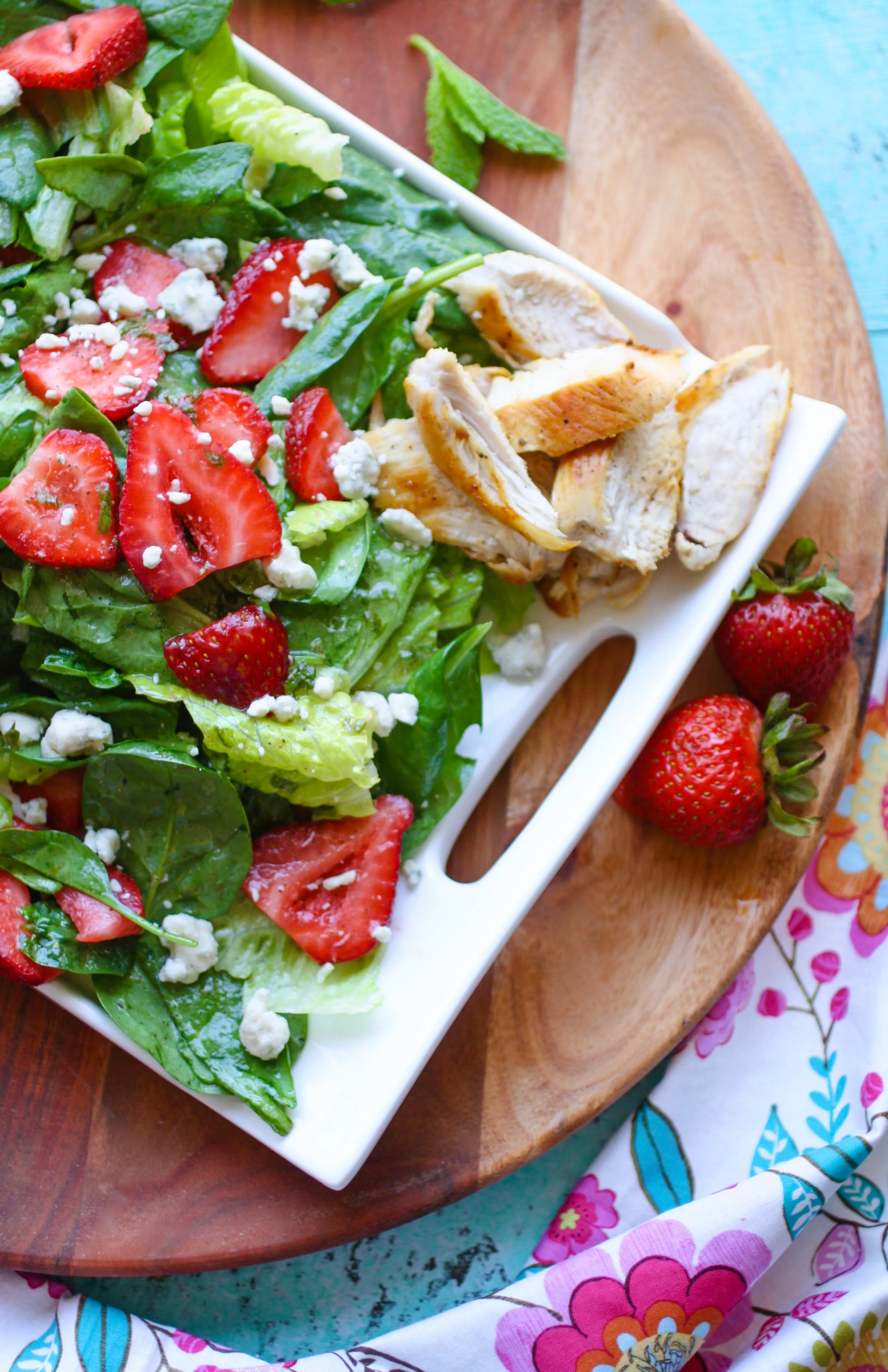 Chicken Salad with Strawberries and Honey-Lemon Mint Dressing is a sweet, satisfying meal. You'll love the flavors and colors in this easy-to-make, hearty salad.