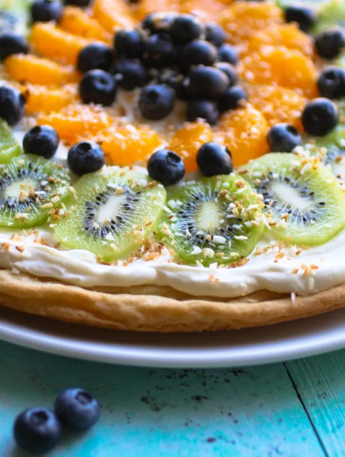 Sugar Cookie Fruit Pizza is a super-simple dessert to make! It's perfect for picnics and holidays!
