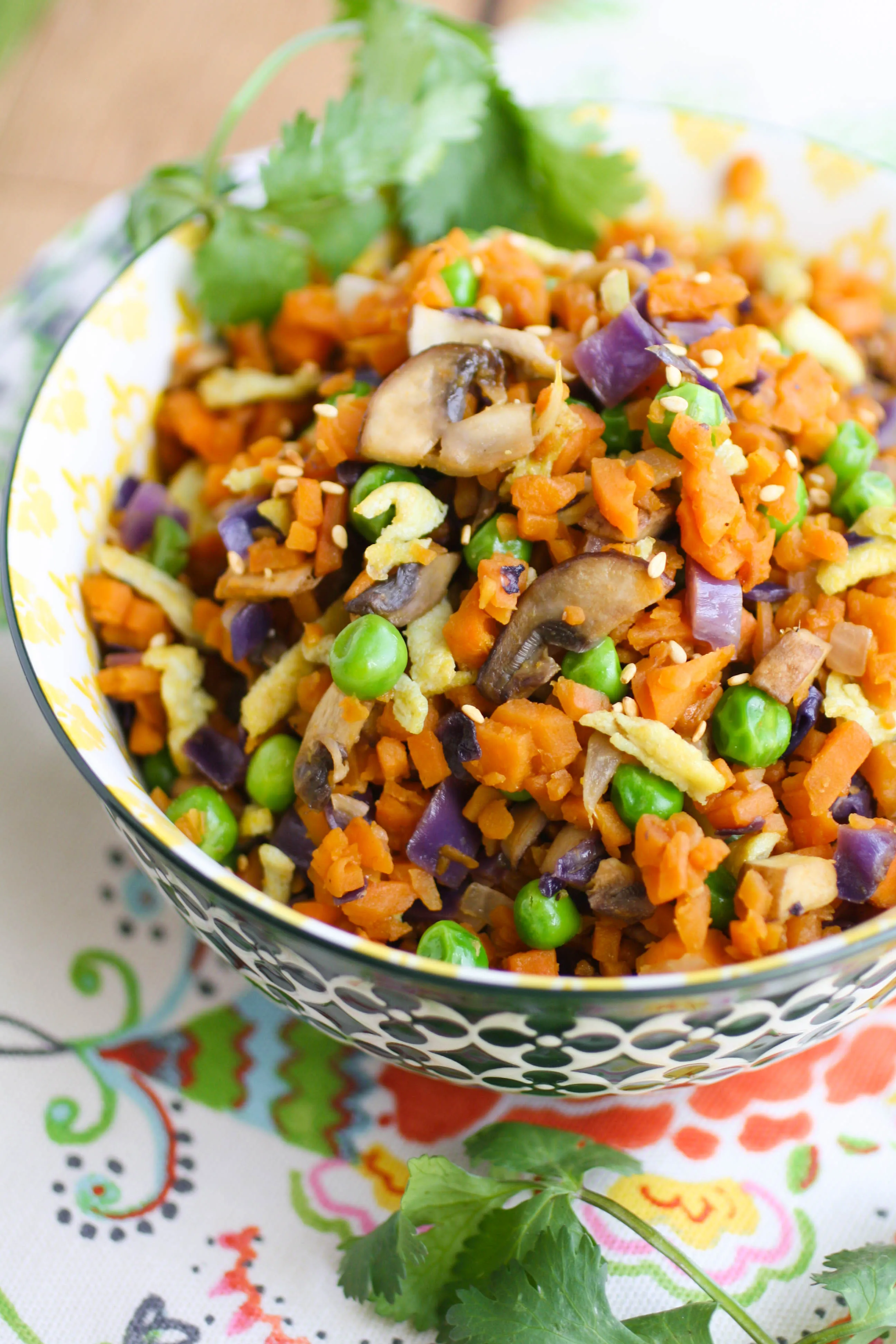 Sweet Potato "Fried Rice" is a fun and colorful dish your family will love! Try it as a healthy dish to serve on a Meatless Monday, too!