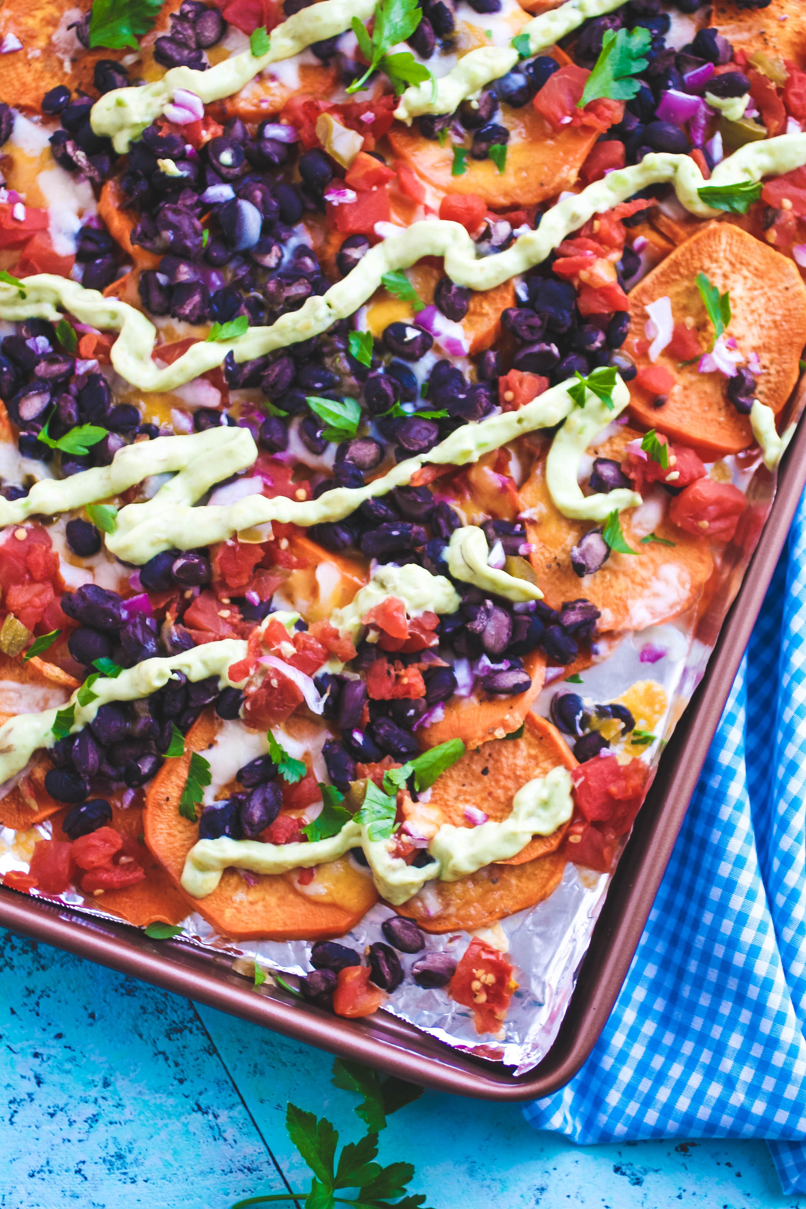 Sweet Potato Nachos with Avocado Crema make a great snack! Sweet Potato Nachos with Avocado Crema are filling and fun to snack on.
