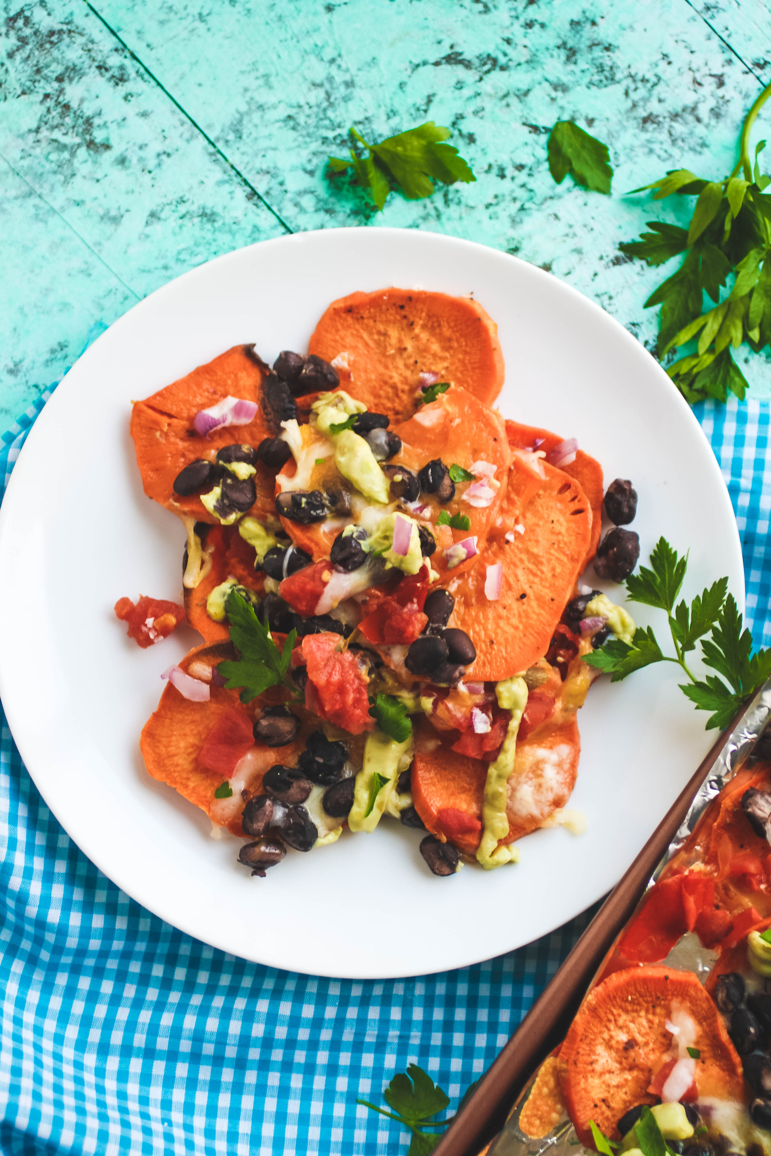 Sweet Potato Nachos with Avocado Crema are a tasty, hearty snack. You'll love Sweet Potato Nachos with Avocado Crema anytime!