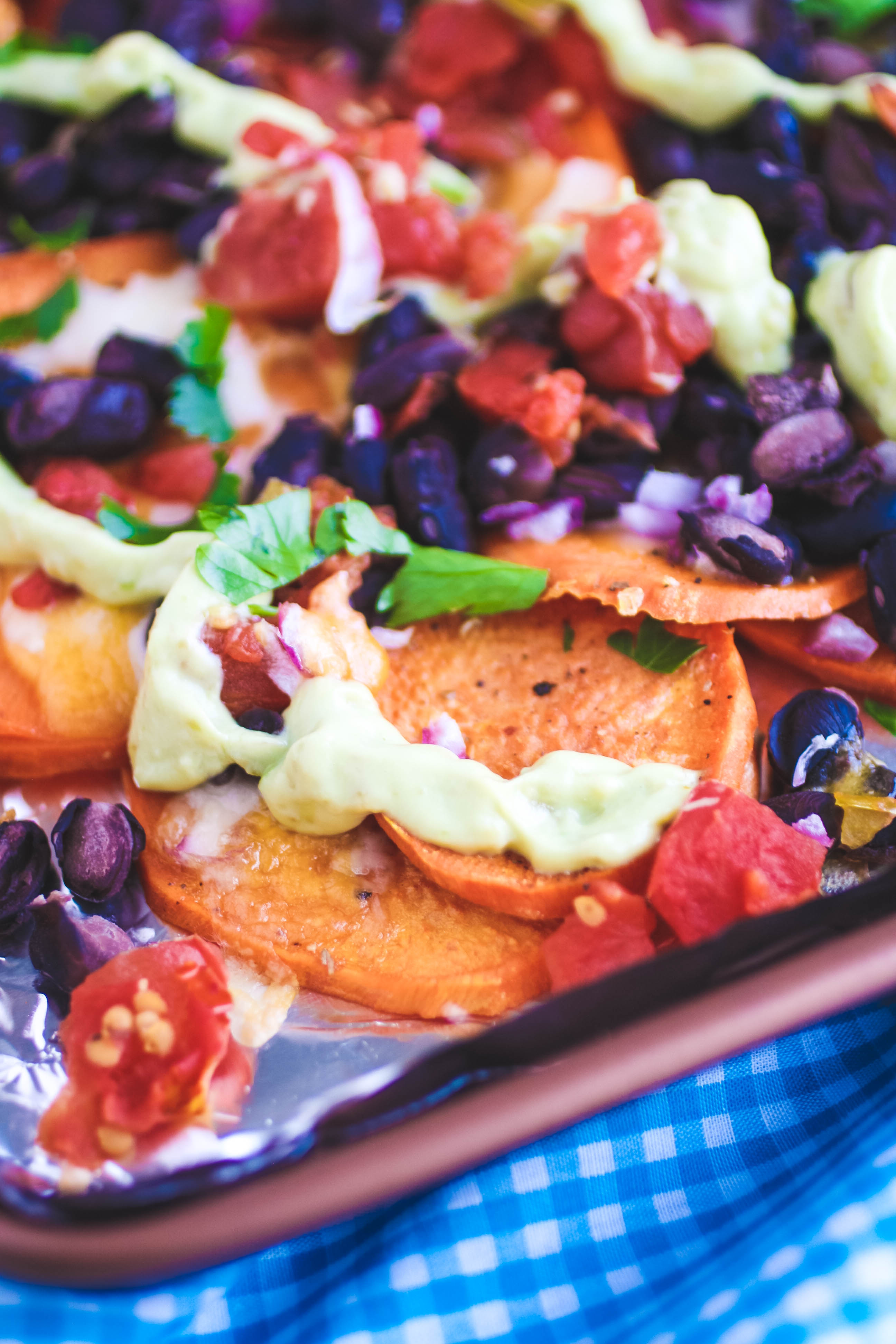 Sweet Potato Nachos with Avocado Crema makes a great light meal or snack. Sweet Potato Nachos with Avocado Crema is tasty and a healthier snack option!