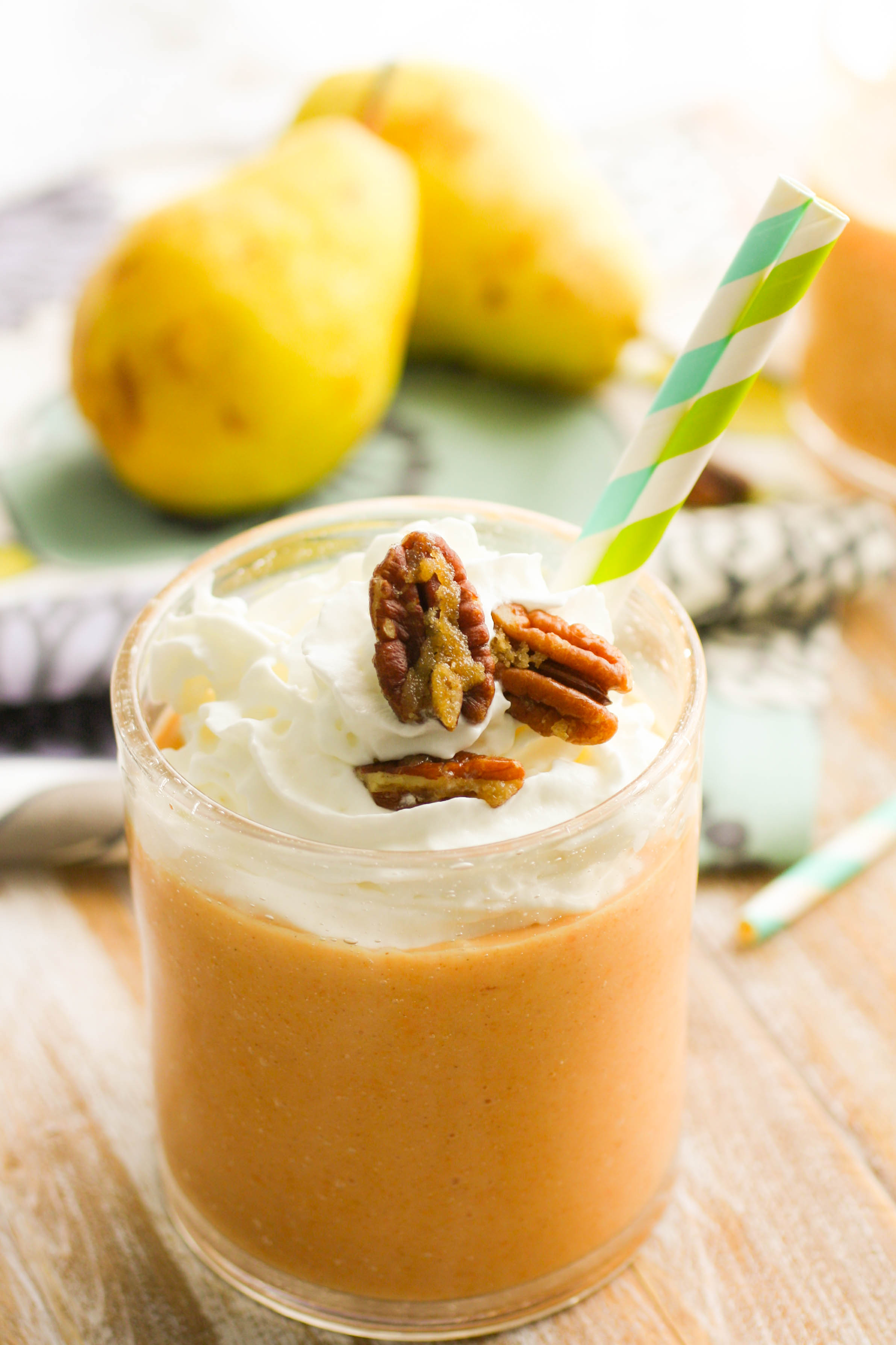 Sweet Potato-Pear Smoothies with Candied Pecans will have you toasting to fall! These smoothies are great in the morning, and make a great dessert, too!