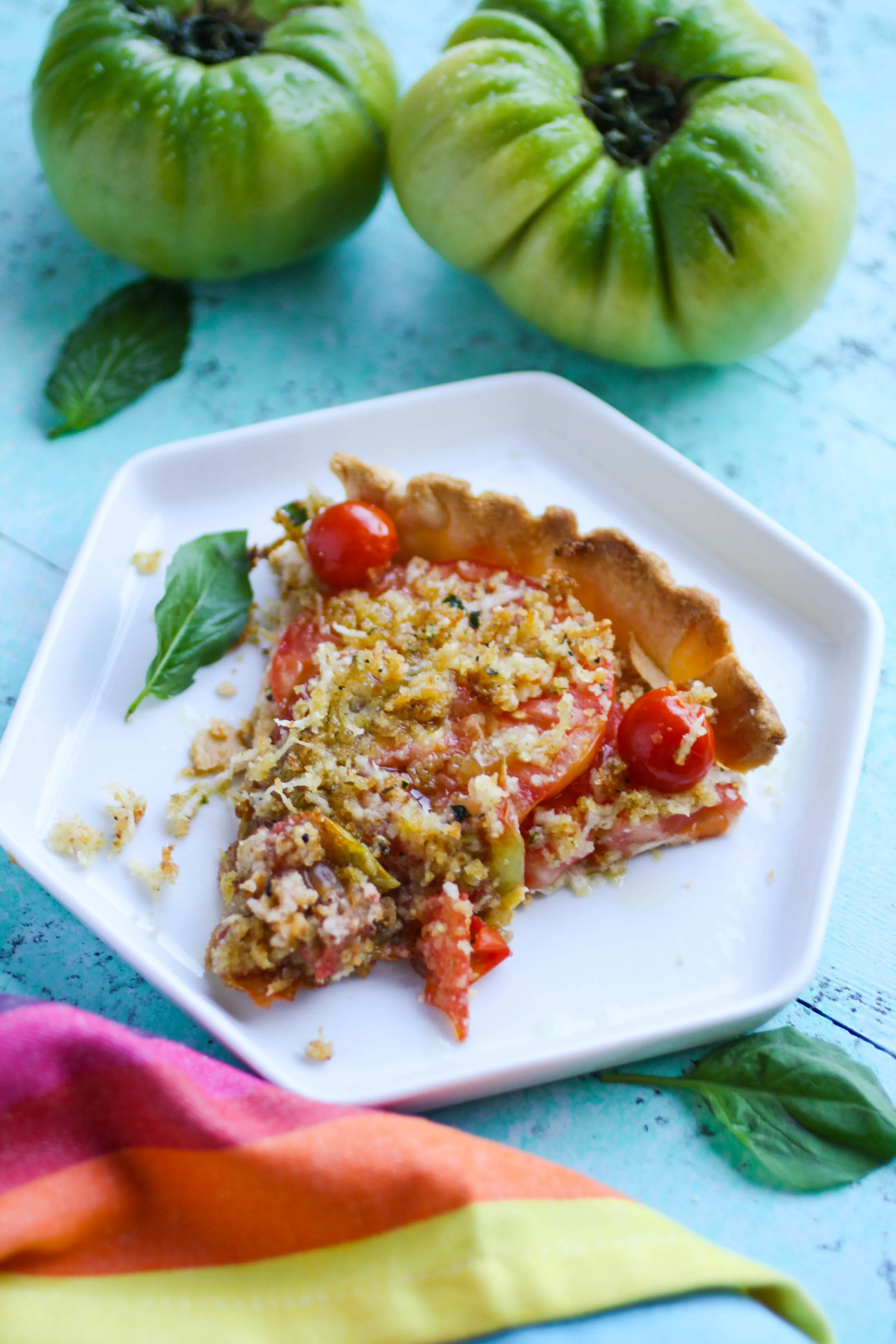 Tomato Tart with Cheesy Breadcrumbs is a bit of summer in a pan. Fresh tomatoes make this simple dish everything! You'll love this as an appetizer, or as part of a light meal.