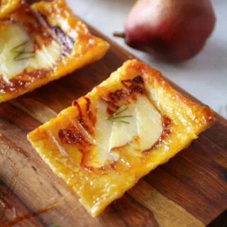 Looking down on a rectangle of golden, flaky tart with pear topping