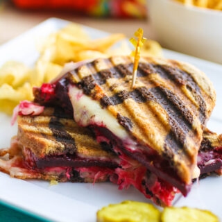 Vegetarian Beet Reuben Panini Sandwich sliced and ready to enjoy!