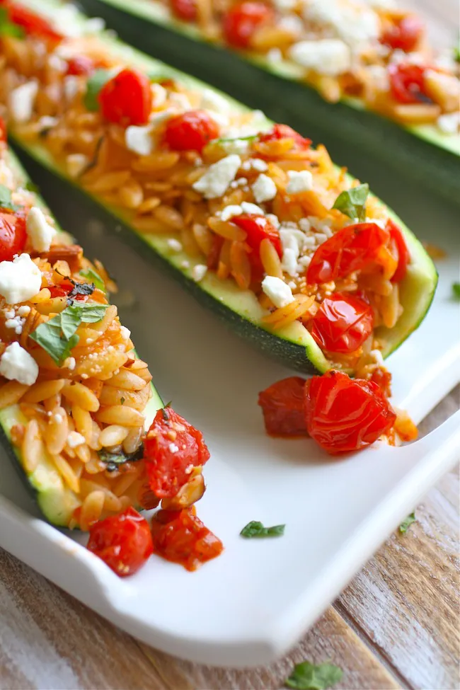Stuffed Zucchini with Herbed Orzo, Almonds, and Fresh Tomato Sauce