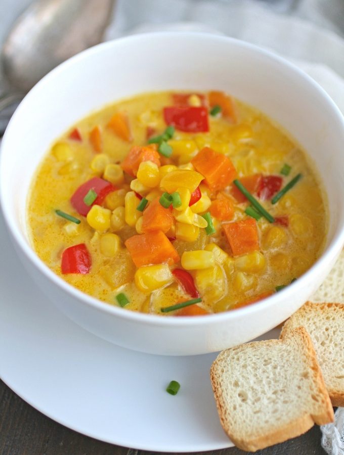 This recipe for Corn and Sweet Potato Chowder with Saffron Cream is rich, colorful, and hearty!