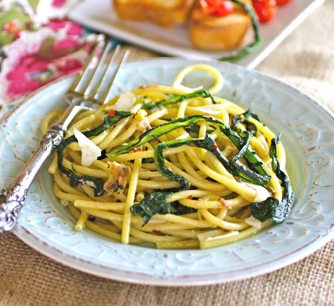 Bucatini with Wilted Dandelion Greens and Anchovy Sauce is a dish to write home about! The flavors are fab in this unique pasta dish!