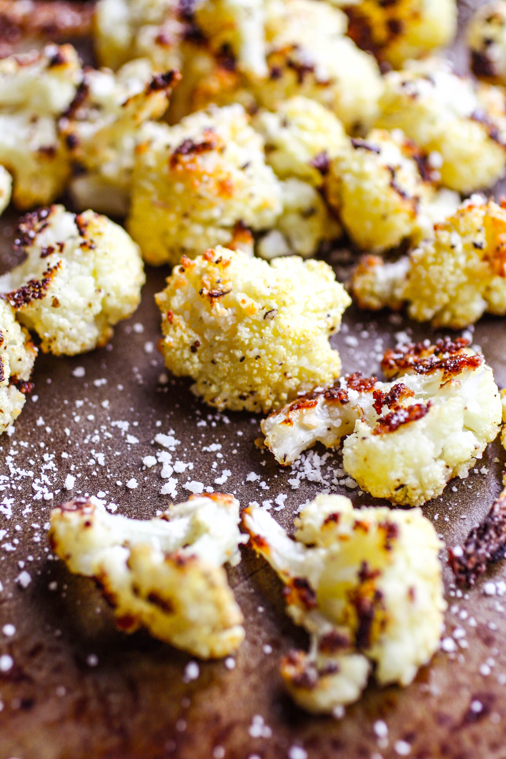 A roasting pan loaded with Parmesan & Herb Roasted Cauliflower Bites