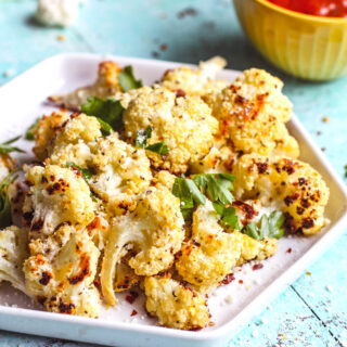Parmesan & Herb Roasted Cauliflower Bites are a fun and tasty snack. A dish of Parmesan & Herb Roasted Cauliflower Bites is all you need to satisfy hunger for a healthy option.