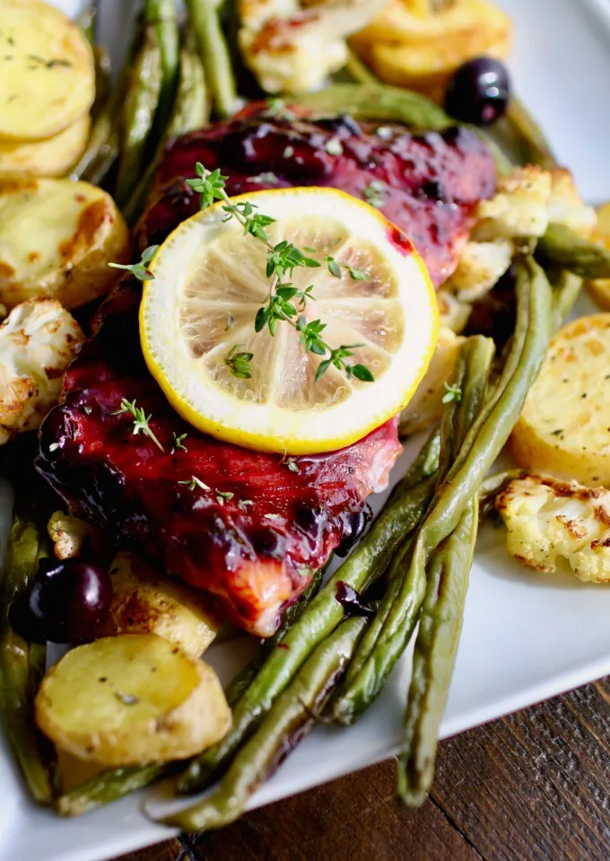 The flavors in this recipe for Sheet Pan Blueberry-Balsamic Glazed Salmon are amazing!