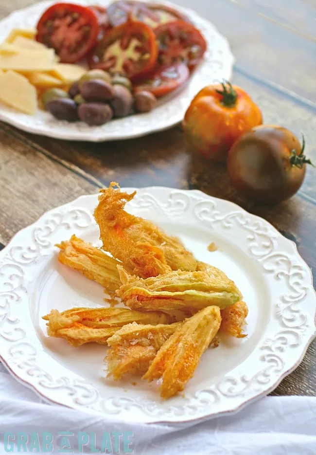 Delight in the summer with this appetizer for Fried Zucchini Blossoms