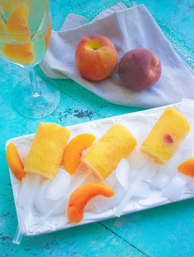 Frozen Peach Bellini Push Pops are true summer fun! Frozen Peach Bellini Push Pops are a great way to chill out on a hot day.
