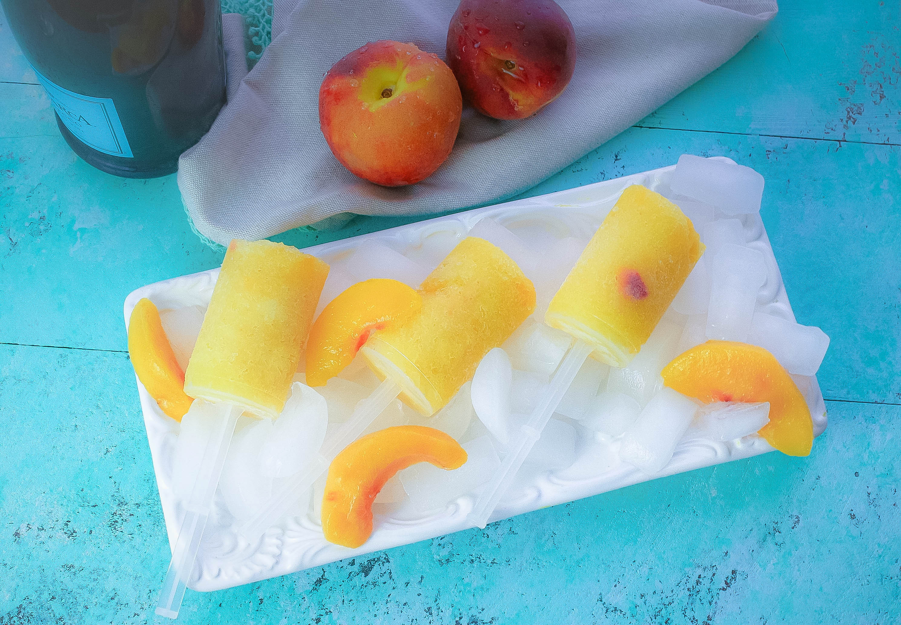 Frozen Peach Bellini Push Pops are great adult treats for summer fun! Frozen Peach Bellini Push Pops remind you of summers gone by and are a fun adult treat!