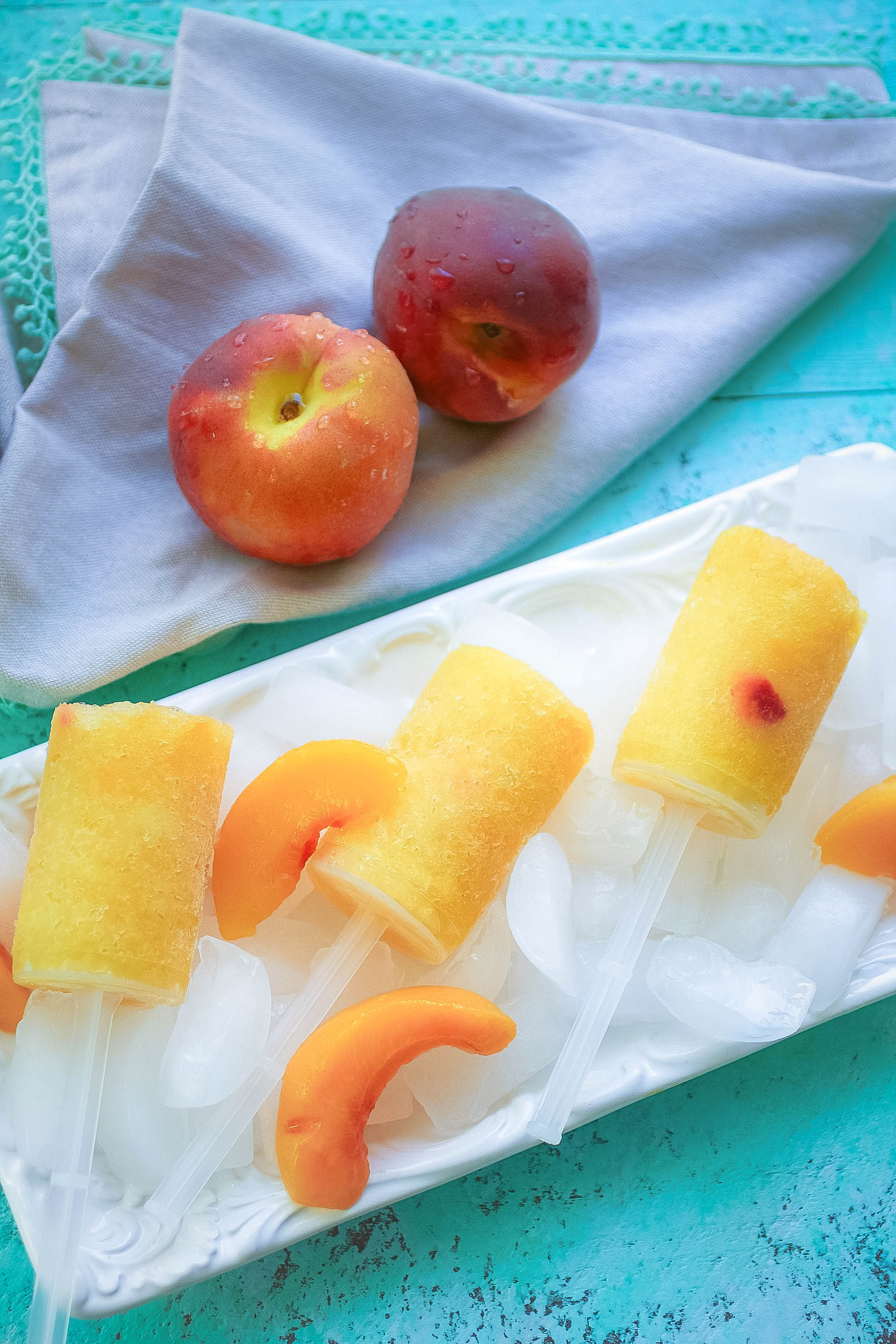 Frozen Peach Bellini Push Pops are a fun, frosty adult treat. Frozen Peach Bellini Push Pops are a fun way to beat the summer heat.