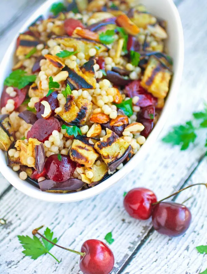 Grilled Eggplant, Cherries, and Couscous Salad is a great dish for the summer grilling season. Grilled Eggplant, Cherries, and Couscous Salad makes a great Meatless Monday dish!