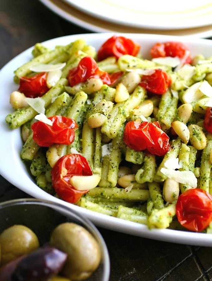 Kale Pesto Pasta with Roasted Tomatoes and White Beans is a simple, flavorful Meatless Monday (or any night of the week) meal!