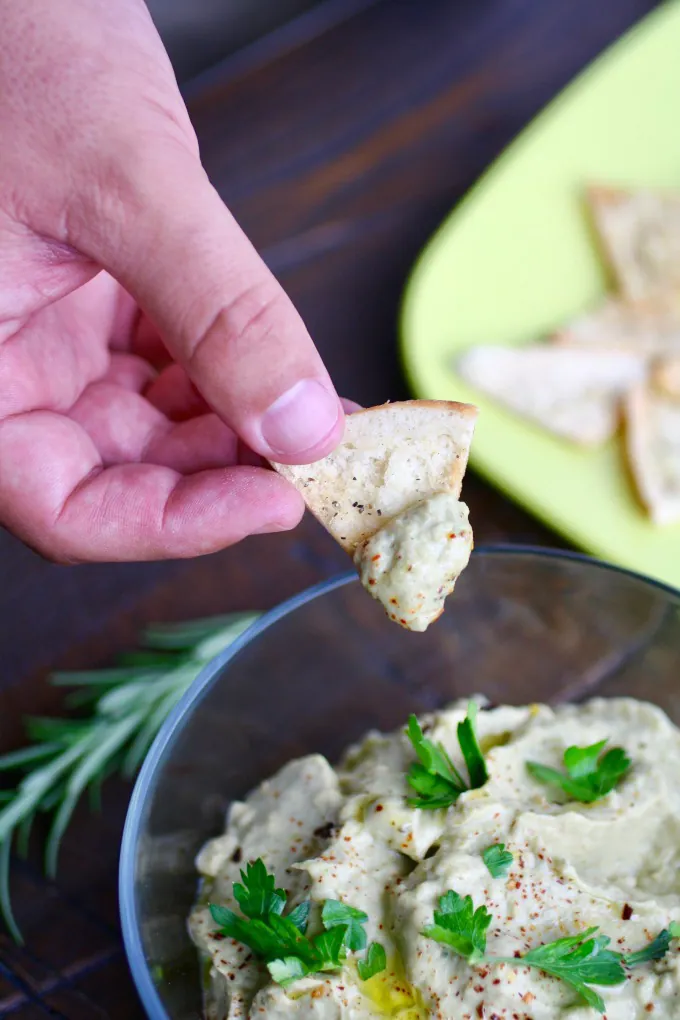 Dip into Roasted Eggplant Dip with Easy Garlic Pita Chips -- so easy to make, and a real crowd pleaser!