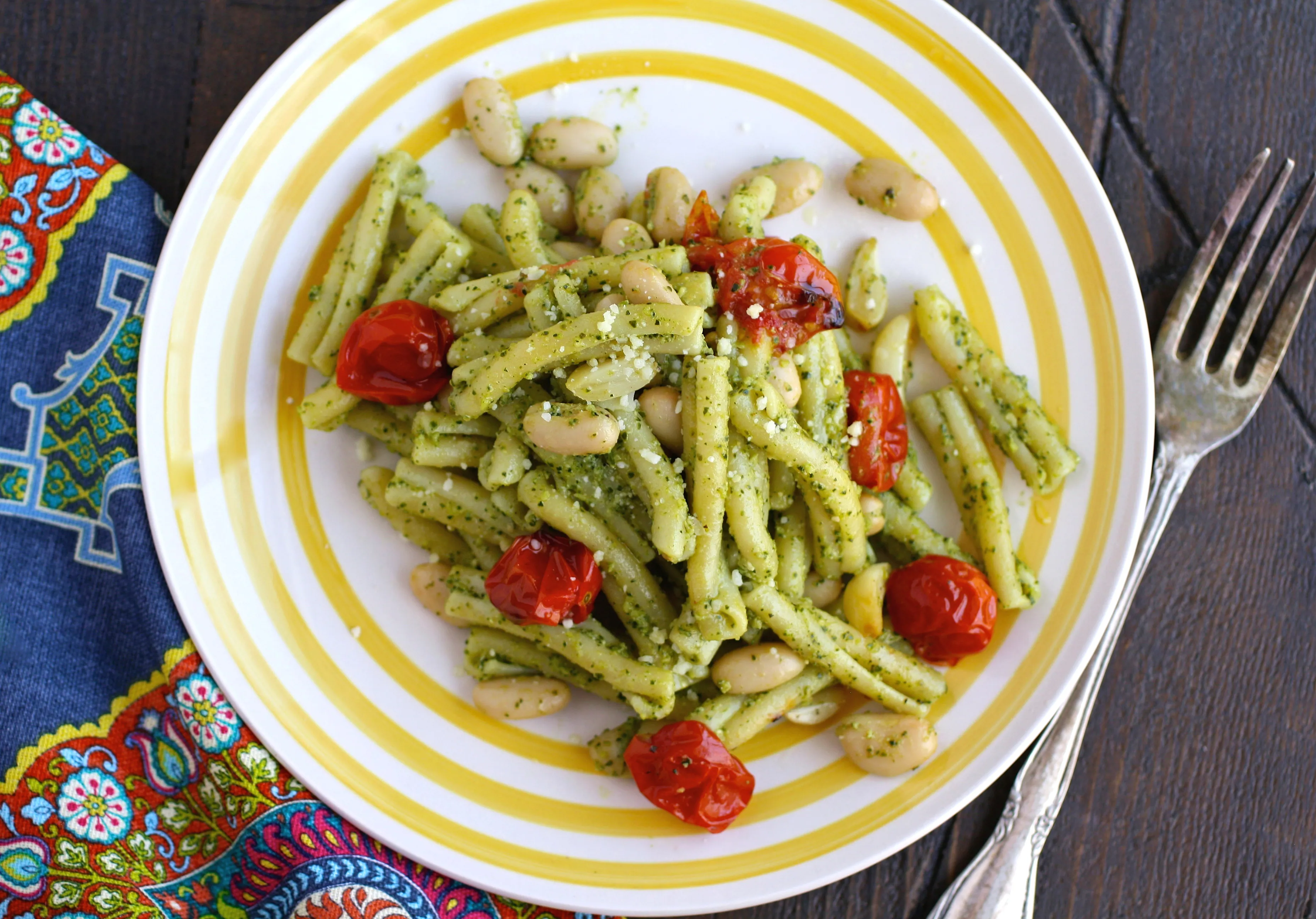 dig in to Kale Pesto Pasta with Roasted Tomatoes and White Beans for a flavorful meal!