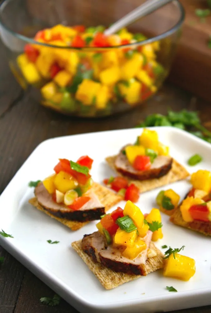Leave the chips and salsa for another time! Try Pork Tenderloin Bites with Mango Salsa for a hearty appetizer instead!