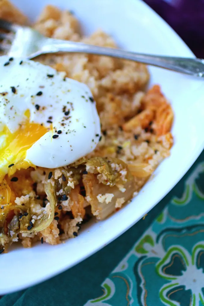 Dig into an easy-to-make and flavorful dish like Kimchi and Cauliflower Fried "Rice" with Poached Eggs!