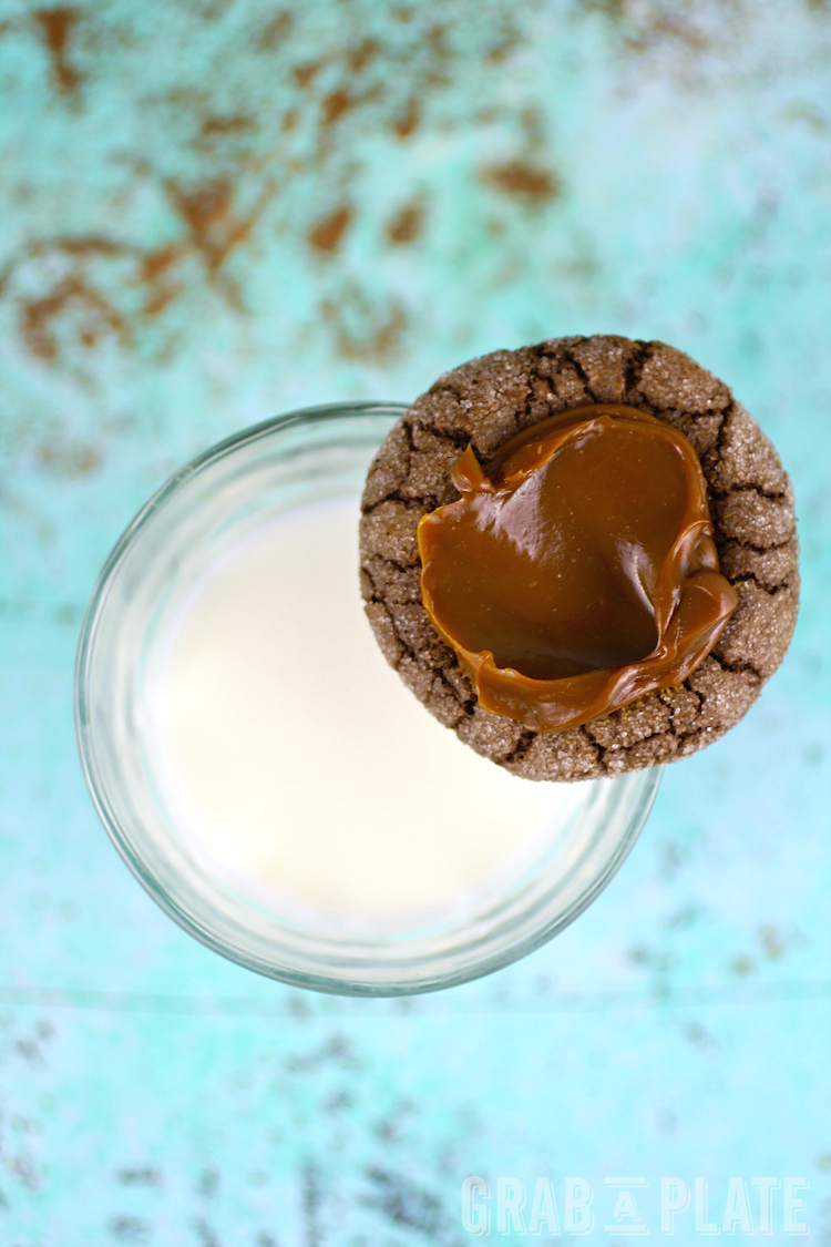 Grab a glass of milk for these spiced Chocolate-Chili Thumbprint Cookies with Dulce de Leche!